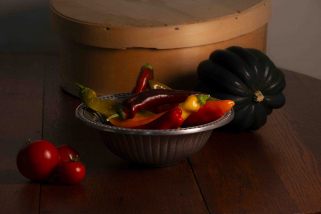 multicolored peppers, green squash and red tomoatoes in pewter bowl, poivrons multicolores, courges vertes et tomates rouges dans un bol en étain